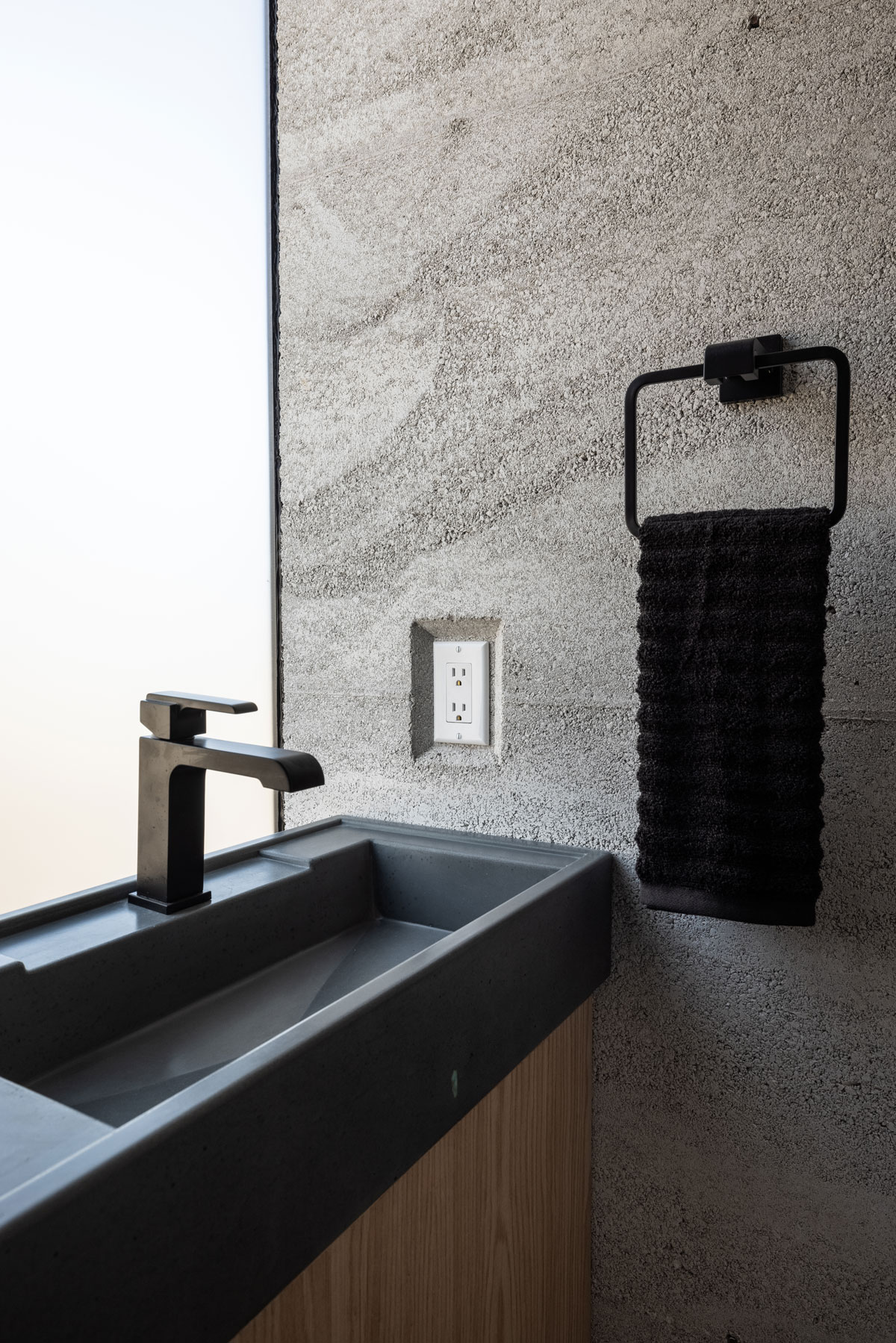 Concrete Sink + Rammed Earth + Custom Oak Cabinet