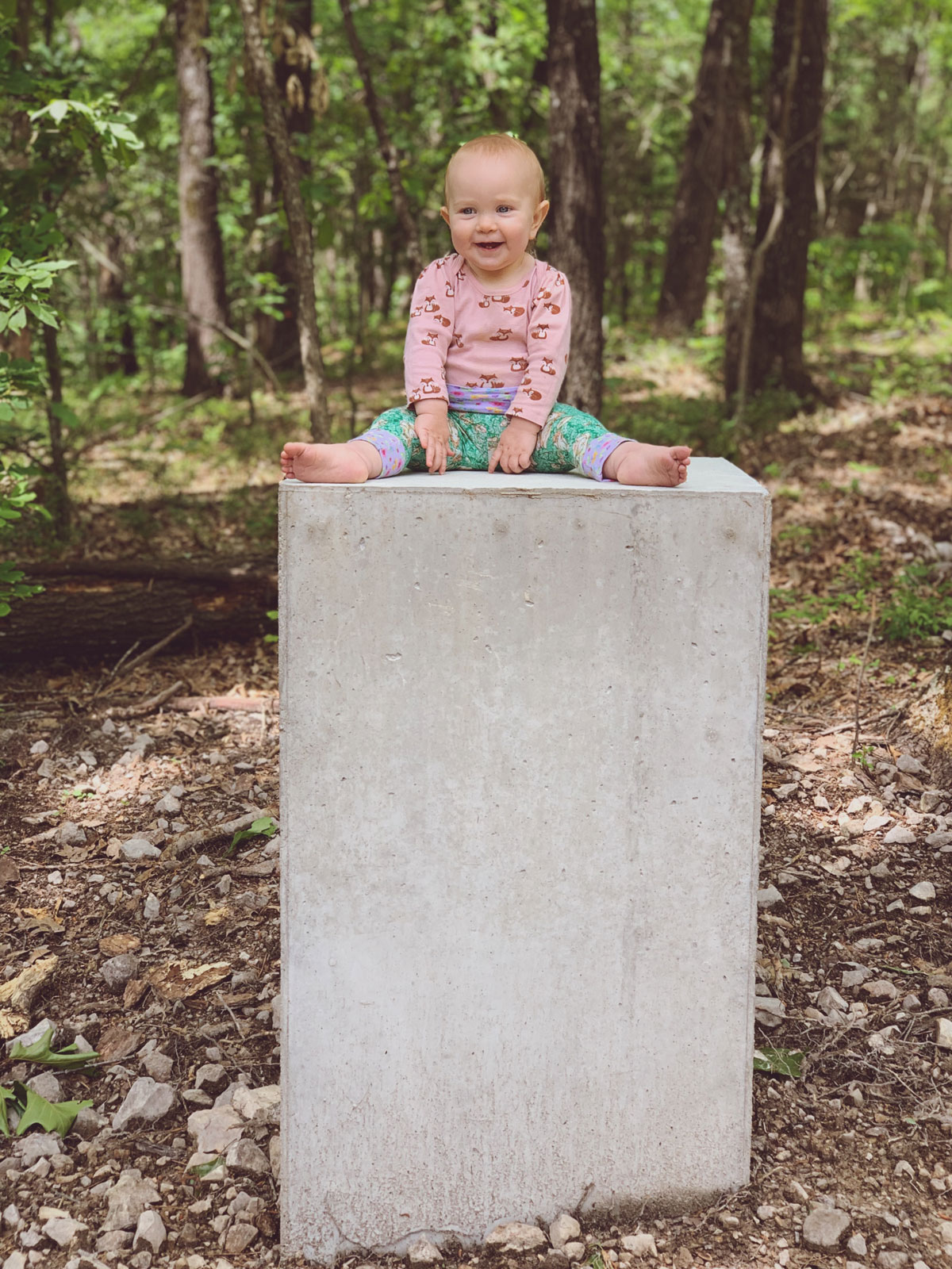 Brandon Gore's beautiful daughter sitting on a concrete art plinth - perhaps the most perfect artwork?