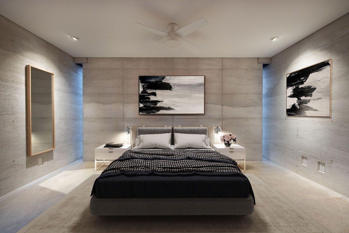 The master bedroom in a modern rammed earth cabin built in the Ozark Mountains of Eureka Springs, AR, USA