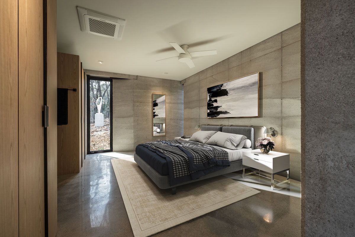 A modern yet warm master bedroom in this rammed earth cabin in the United States