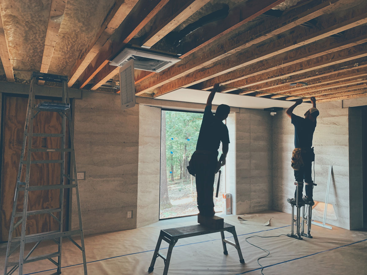 Hanging drywall in the arkansas modern cabin