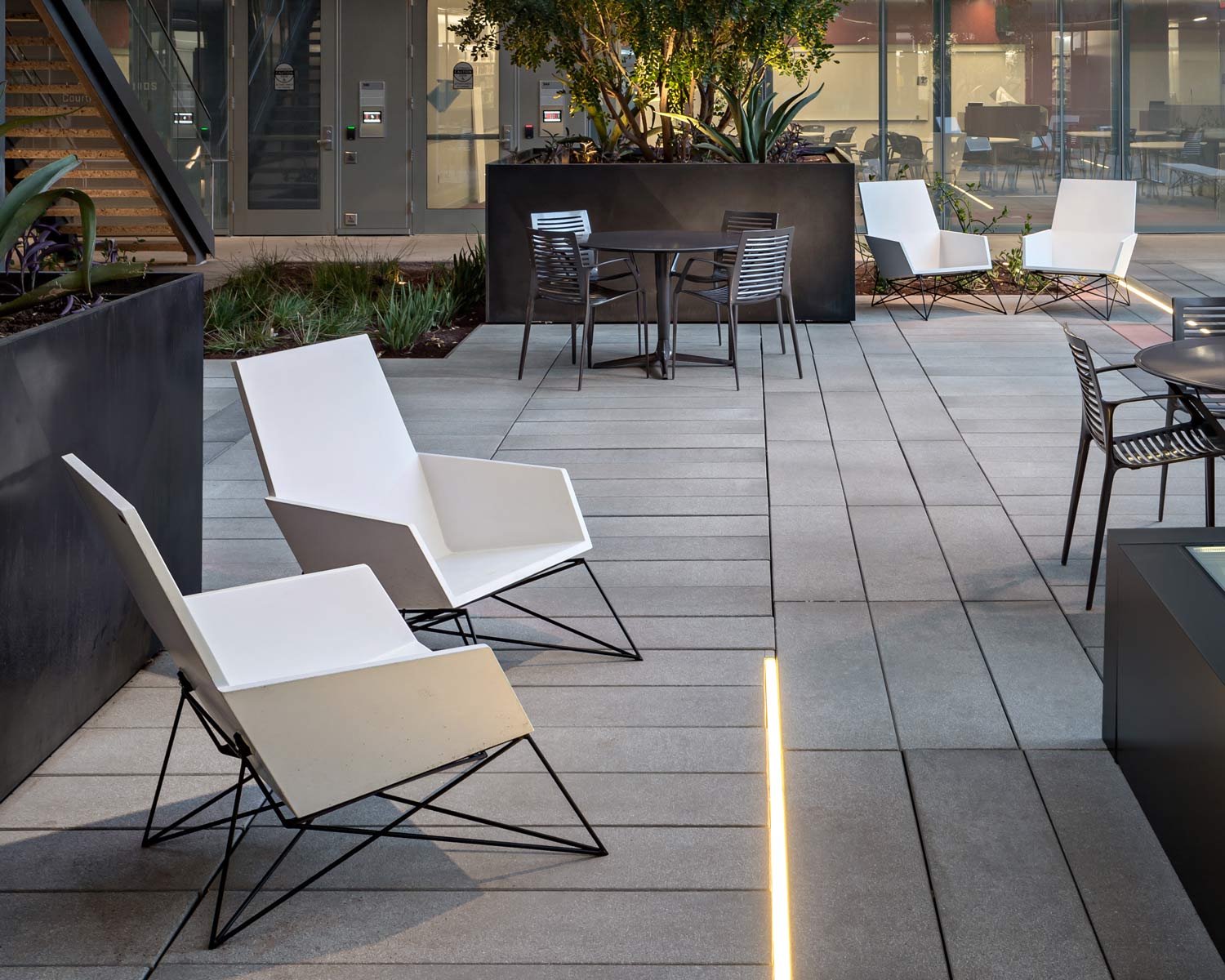 Concrete + Steel Modern Muskoka Outdoor Chairs and faceted black GFRC concrete wall cladding panels 