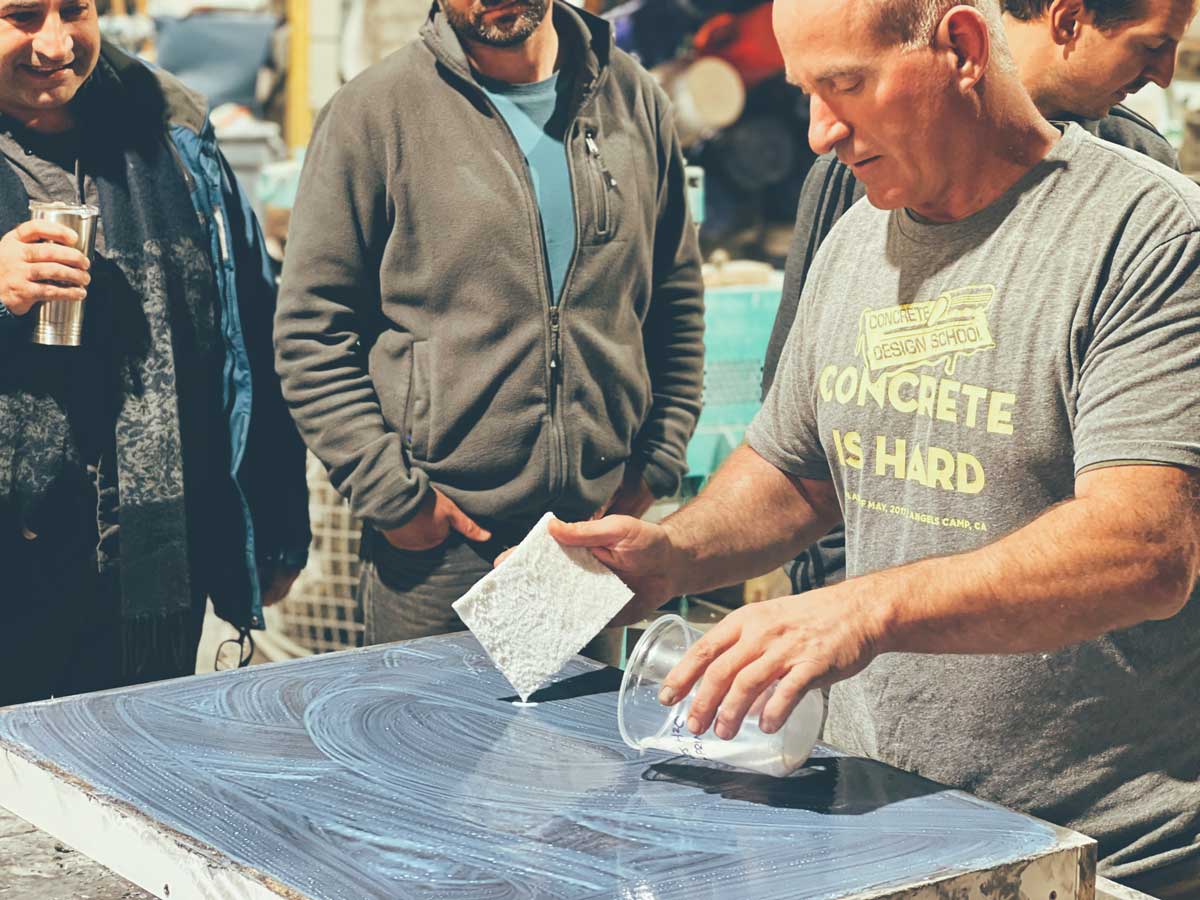 Jon Schuler applying ICT Reactive Concrete Sealer to a concrete countertop