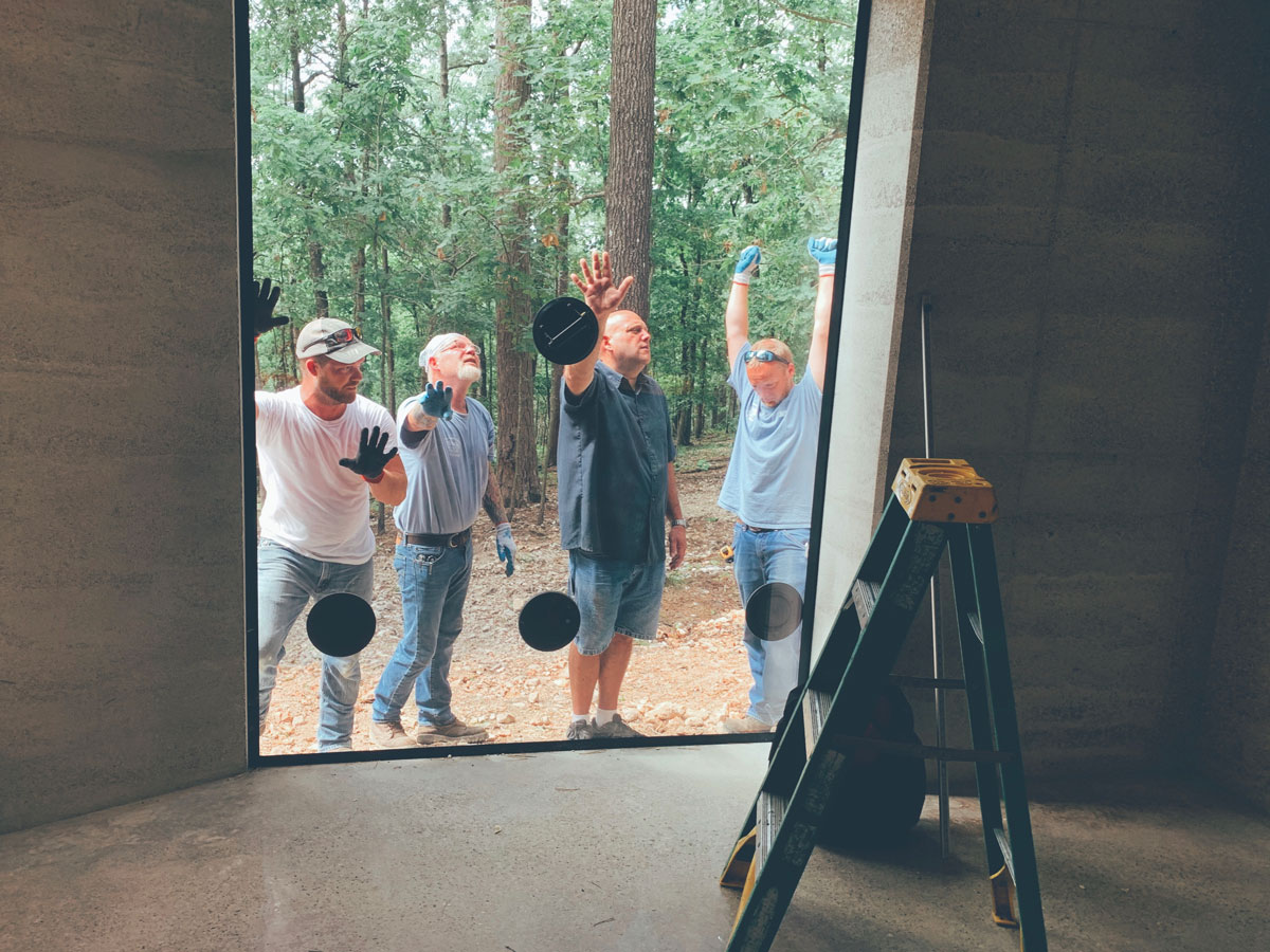 The huge LowE insulated window, just after being installed into the rammed earth opening