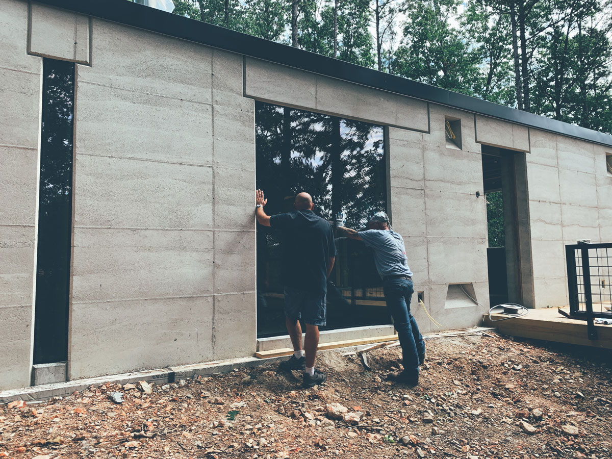 A big window in a big opening - a lot of planning went into forming the rammed earth wall and lintel to accommodate the glass.