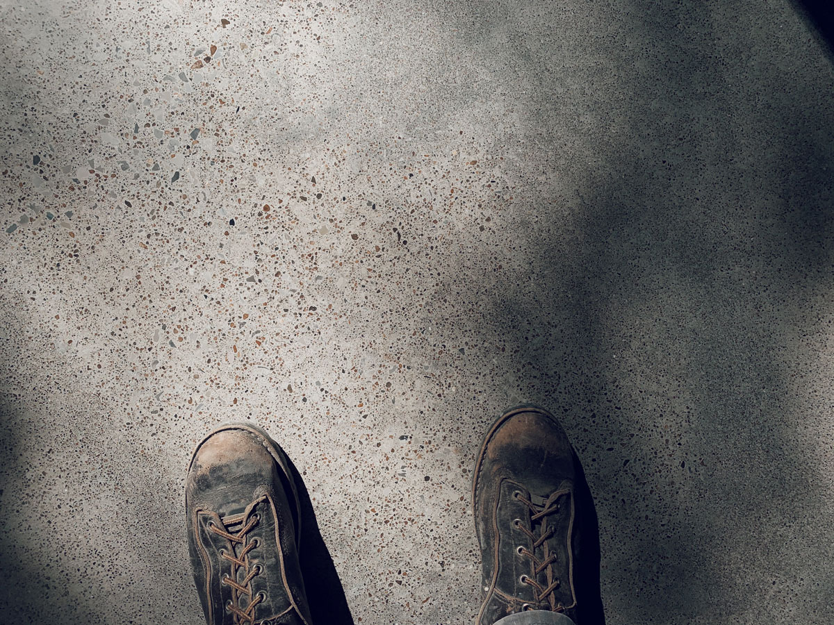 The colors of the stones from a local creek that were exposed in the concrete terrazzo floor or exquisite