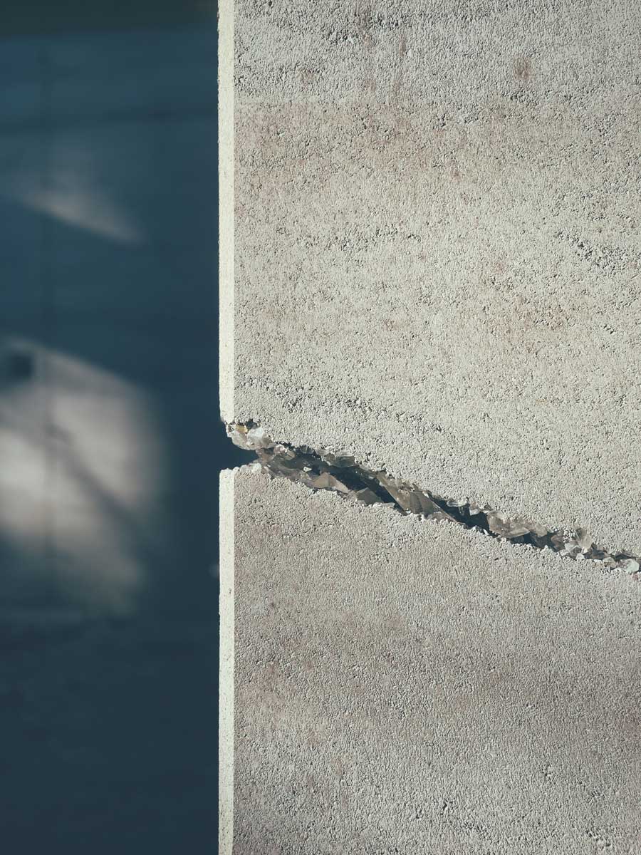 Arkansas quartz crystals embedded in a rammed earth wall on a modern cabin project in Eureka Springs, AR